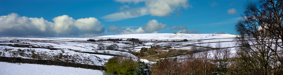 Panoramic view of a Yorkshire dale after an unexpected snowfall in April