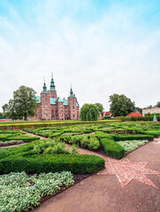 Breathtaking magical landscape with park patterns in famous Rosenborg Castle in Copenhagen, Denmark. Exotic amazing places. Popular tourist atraction.