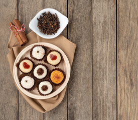 Fototapeta na wymiar Typical gourmet brazilian brigadeiros, various flavors over wooden table with copy space