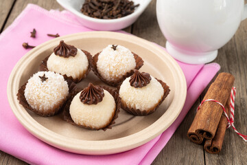 Typical gourmet brazilian brigadeiros, various flavors over wooden table