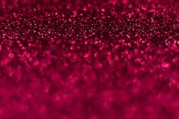 Pink sparkling glitter bokeh background, christmas abstract defocused texture. Holiday lights