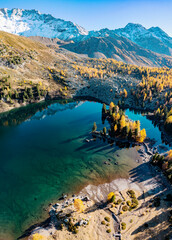 Purple lake in Val di Campo near Poschiavo, Switzerland, aerial view
