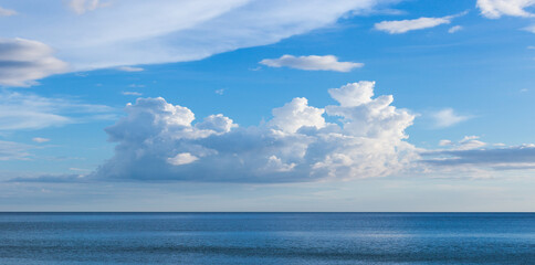 Fototapeta na wymiar beautiful sky and clouds landscape, nature outdoors in summer at sea