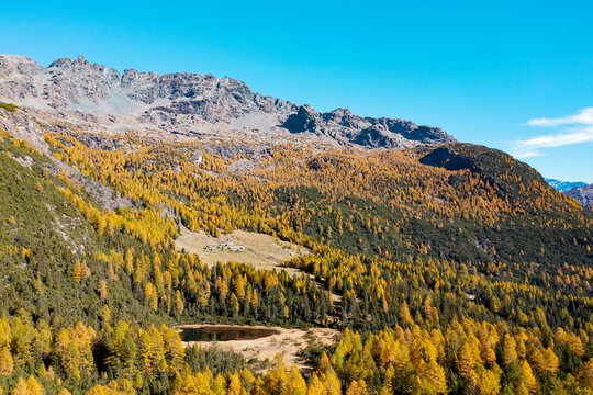 autumn aerial view of the Entova lake in Valmalenco, Italy