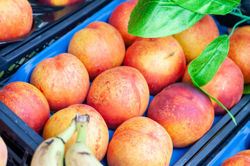 Different varieties of peaches on sale in a local bazaar kemer turkey. Fresh fruits for juice