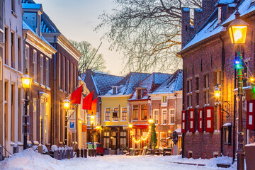 Restaurants and bars with snow and christmas decoration during wintertime in Doesburg, The Netherlands
