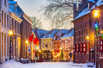 Restaurants and bars with snow and christmas decoration during wintertime in Doesburg, The...