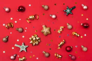Red Background with Holiday Christmas Decoration Balls Confetti Christmas Wallpaper Flat Lay Top View Horizontal