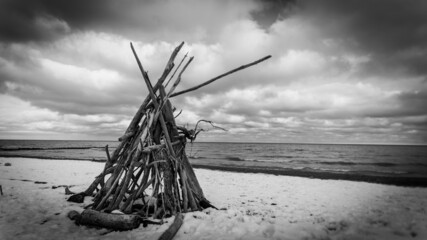 Old wooden hut on the beach surrounded by the sea in Wisconsin, the US