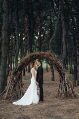 walk of the bride and groom through the autumn forest