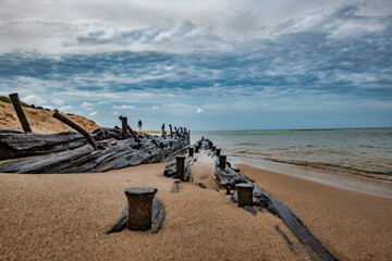 Ancient shipwreck on the beach.