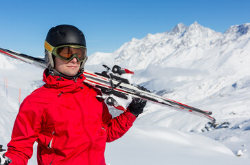 Fototapeta na wymiar Young Man On Ski Holiday In the Mountains