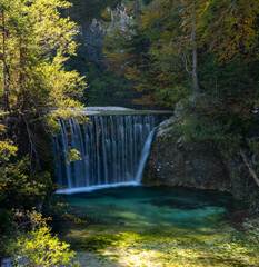 view of the Pisnica Waterfall near Kranjska Gora in the Julian Alps of Slovenia in late autumn