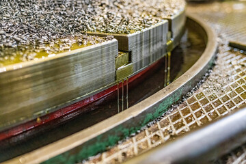 The shavings and oil drain into the sump when the tooth is cut with the gear cutter.