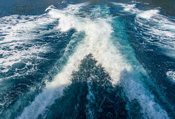 Close-up of the wake of a speedboat or ship, view from the stern of the boat, water, photography,...