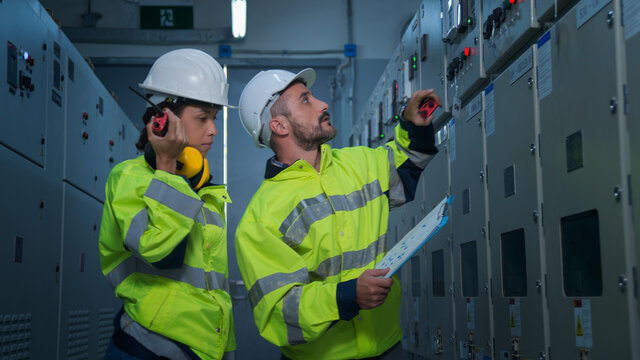 engineer working on the checking status switchgear electrical energy distribution substation