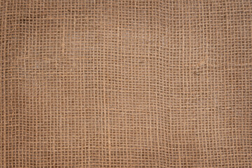 Background made of natural fabric burlap with square cells