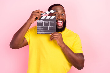 Photo of afro american brown haired stylish trendy man wear yellow t-shirt film director isolated...