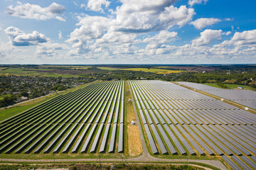 Aerial view of the Solar panels on a hill above the river in Kamianka, Ukraine - 465071926