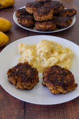 German meatballs called Frikadellen served with potato salad