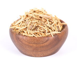 Muira Puama herbal tea in wooden bowl, isolated on white background. Natural potency wood,...