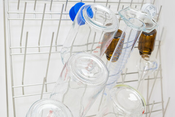 Chemical glassware are drying on the holder in chemical scientific laboratory.