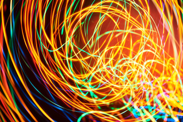 Dynamic abstract background, lines of colored lights in a messy vibrant spiral