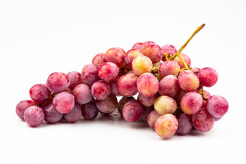 A bunch of  pink grapes close-up isolated on a white background.