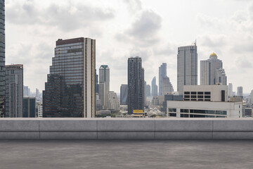 Panoramic Bangkok skyline view, concrete observatory deck on rooftop, daytime. Luxury Asian...