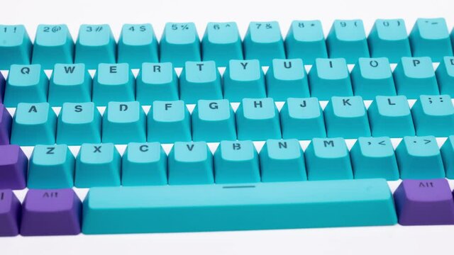 Loose computer keyboard keys panning shot