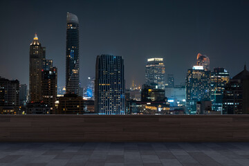 Panoramic Bangkok skyline view, concrete observatory deck on rooftop, night time. Asian corporate and residential lifestyle. Financial city downtown, real estate. Product display mockup empty roof