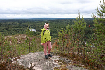Fototapeta premium Woman posing on Mount Hiidenvuori