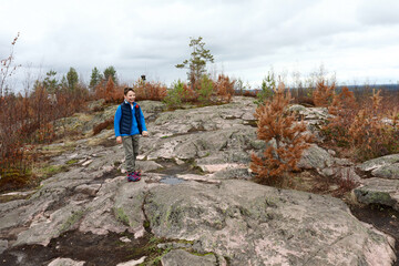 Fototapeta premium Portrait of child on Mount Hiidenvuori