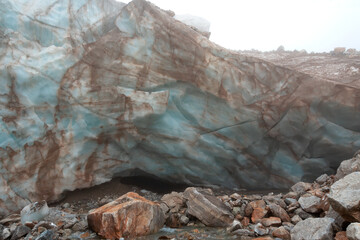 The ice wall of the Shaurtu mountain glacier in the Kabardino-Balkar Republic in the Caucasus