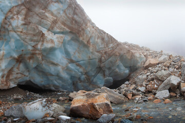 The ice wall of the Shaurtu mountain glacier in the Kabardino-Balkar Republic in the Caucasus