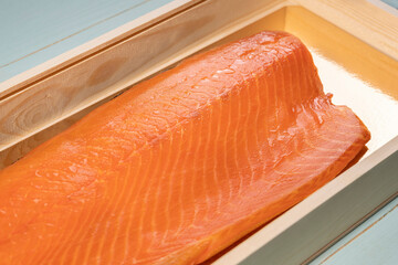 Smoked wild sockeye salmon inside wooden box