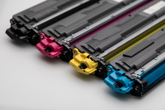 Color Cartridges For Laser Printer On White Background