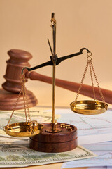 Close-up scales and wooden judge gavel hammer.