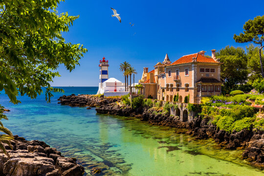 Fototapeta Santa Marta lighthouse and Municipal museum, Cascais, Lisbon, Portugal. Lighthouse Museum of Santa Marta in Cascais Portugal, as seen from Santa Marta Beach on a beautiful day. Cascais, Portugal.