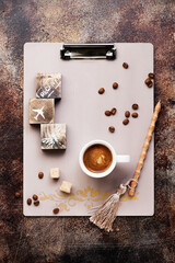 Clipboard, cup coffee, coffee beans and sugar. Top view. Flat lay style.