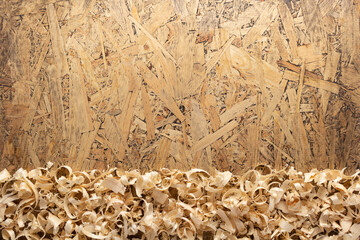 Wood shavings on table background. Wooden shaving at old plank board