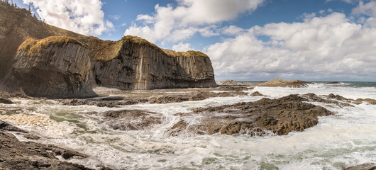 Cape Stolbchaty on the island of Kunashir, Kuril Islands, a unique geological volcanic formation...