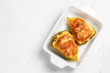 stuffed bell peppers in baking dish. Top view, copy space, flat lay.