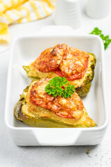 stuffed bell peppers in baking dish. Copy space.
