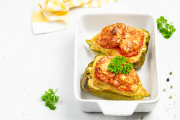 stuffed bell peppers in baking dish. Copy space.
