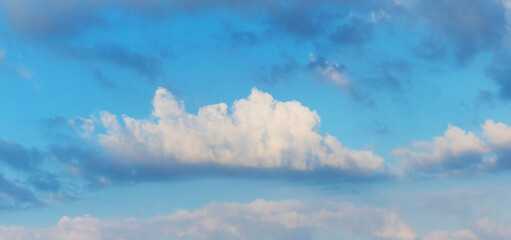 White curly cloud in the blue sky, panorama