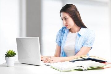 Happy young girl wearing headphone watch webinar on computer