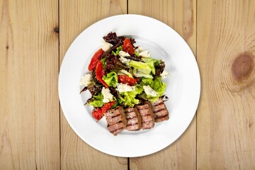 Grilled tasty salad dish and fresh vegetable. Healthy lunch menu.