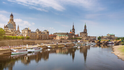 Fototapeta na wymiar Augustus Bridge (Augustusbrucke) and Cathedral of the Holy Trinity (Hofkirche) over the River Elbe in Dresden, Germany, Saxony.