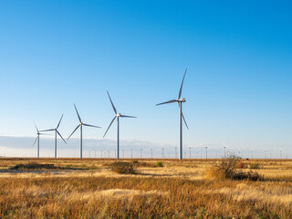 Environmental Conservation by using Wind turbines in a field in the Northern Texas landscape.